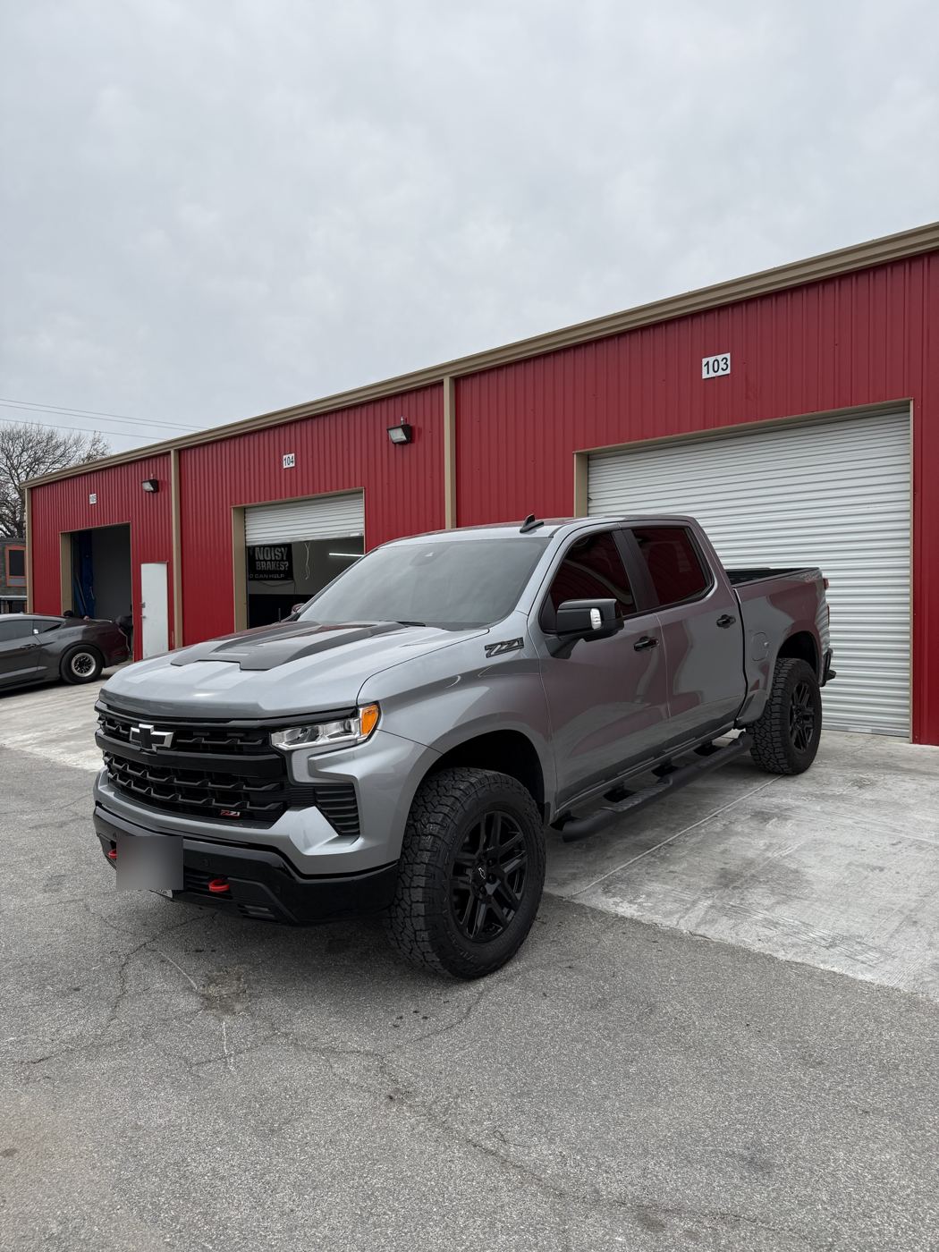 Silver Chevrolet Silverado Trail Boss, front three-quarter view